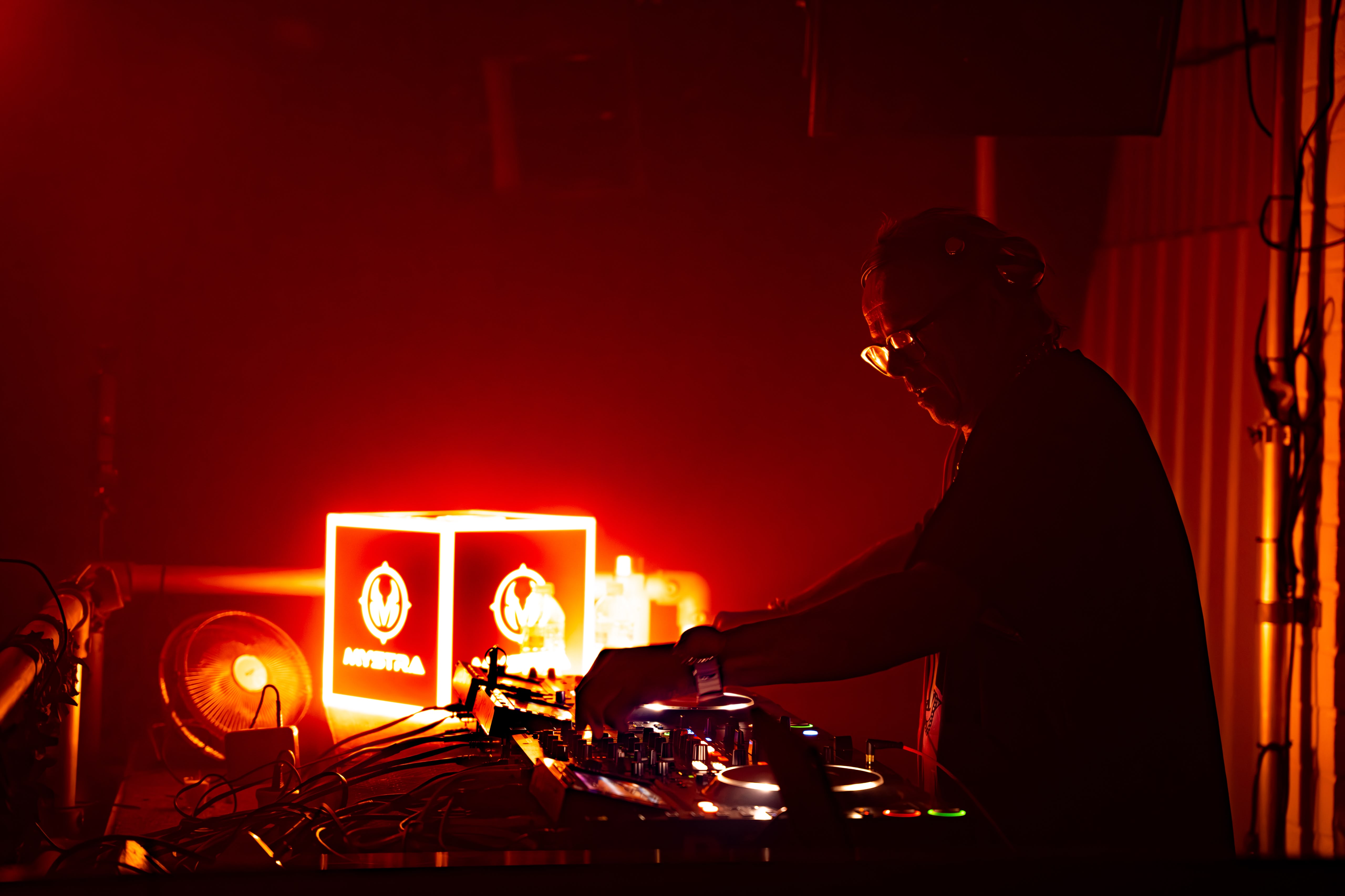 MYSTRA DJ booth and illuminated logo