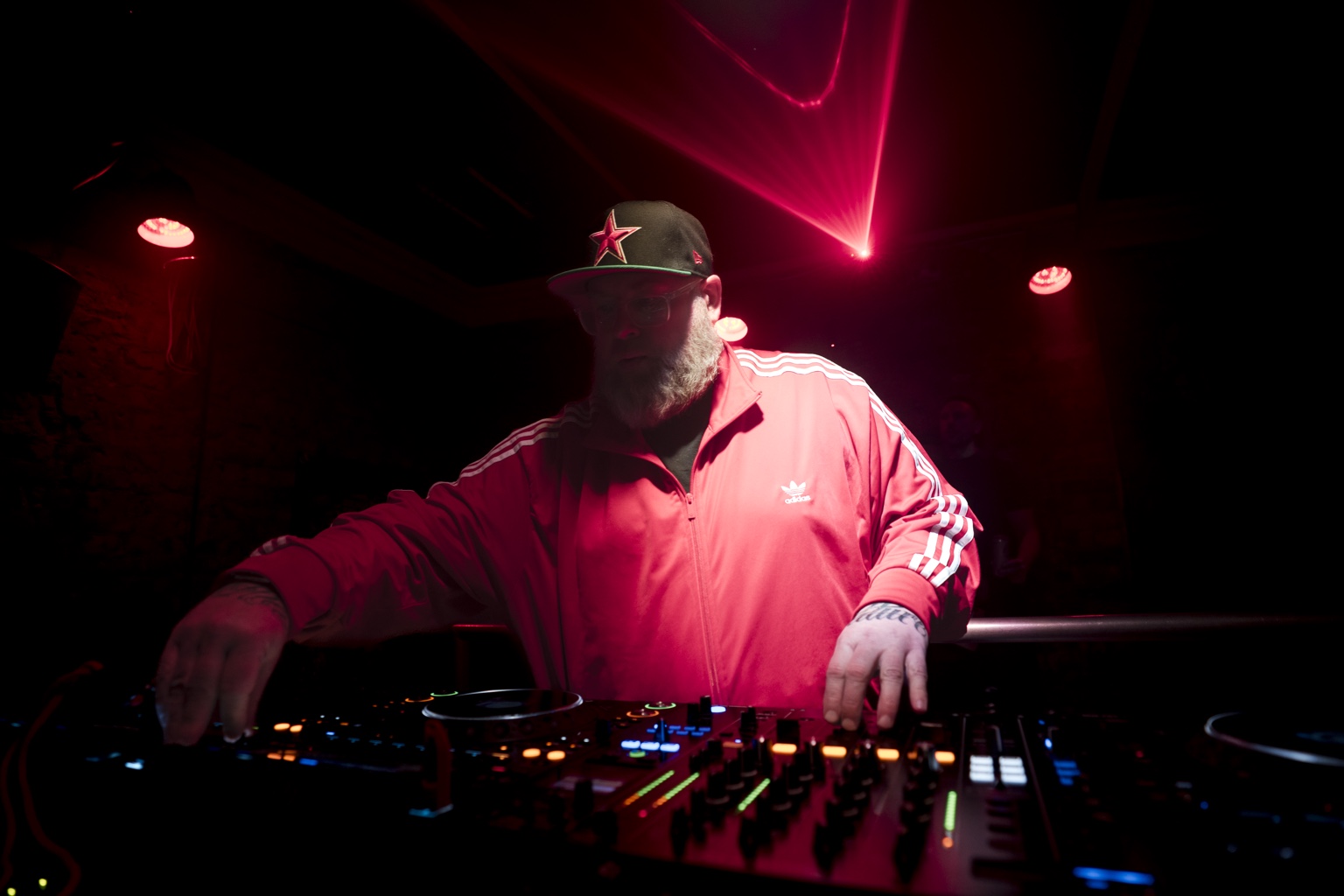 MYSTRA DJ performance under red lights