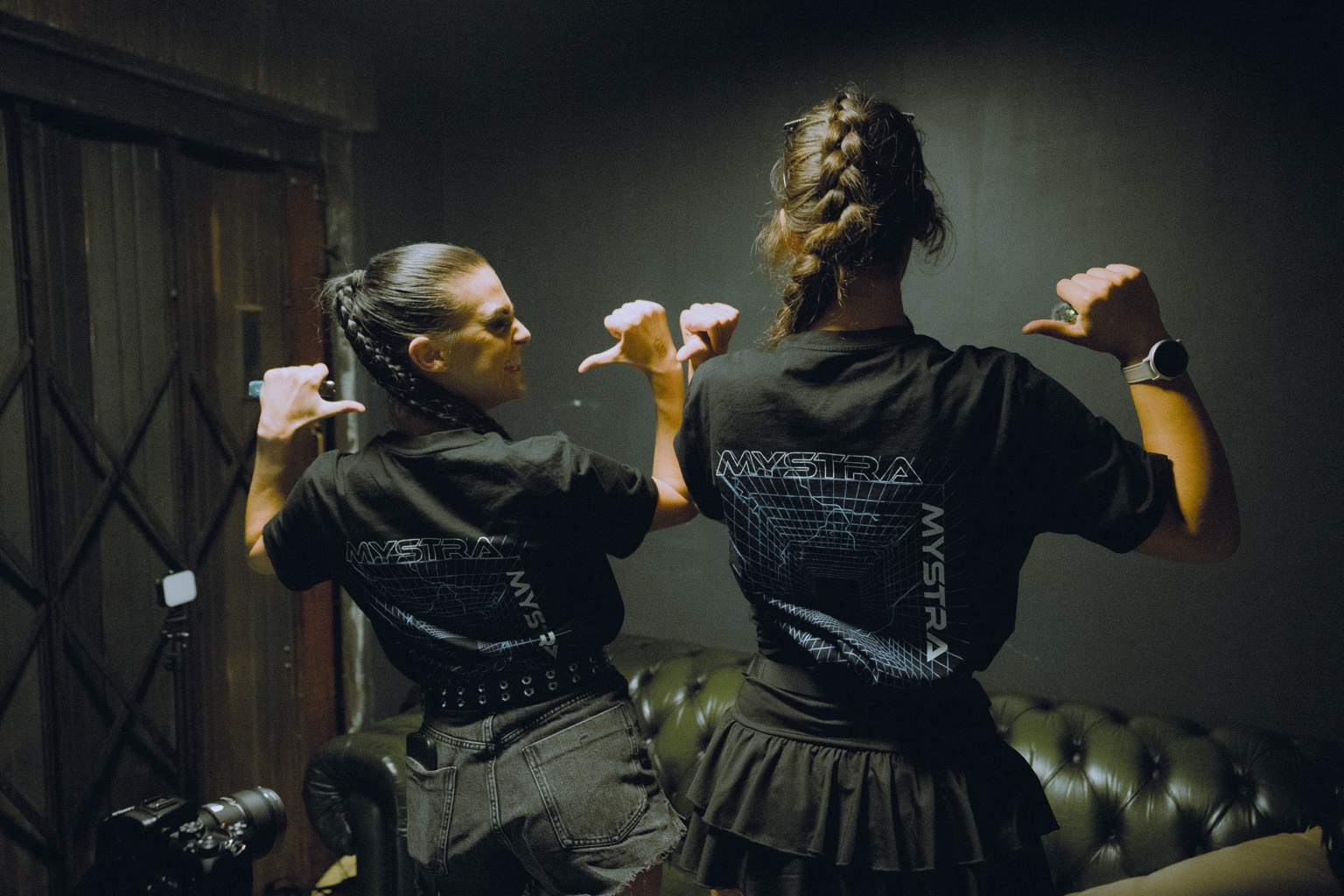 MYSTRA crew wearing MYSTRA shirts